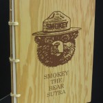 Smokey the Bear Sutra 1993 The text is the poem by Gary Snyder. Signatures sown on cords attached to wooden covers. Letterpress text and screen-printed images. Edition 25. This copy signed by Gary Snyder.