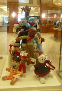 WOU Student and Faculty come together to hand knit these teddy Bears.