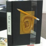 Tell me a secret 1992 Case bound book with a rubber ear on the cover. Readers become participants by writing their secret on the blank pages. Unique.