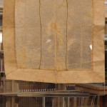ICELAND: Top-Walrus intestine window. Pieces of intestine sewn together to make a transparent, waterproof window. Bottom left-Viking adze head. Bottom right-map of Viking travel routes through the arctic.