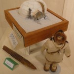 This is a single family snow iglu. Snow iglus like this one were used as temporary shelters while hunting or traveling by Inuit through the arctic. Below is a snow knife and doll.
